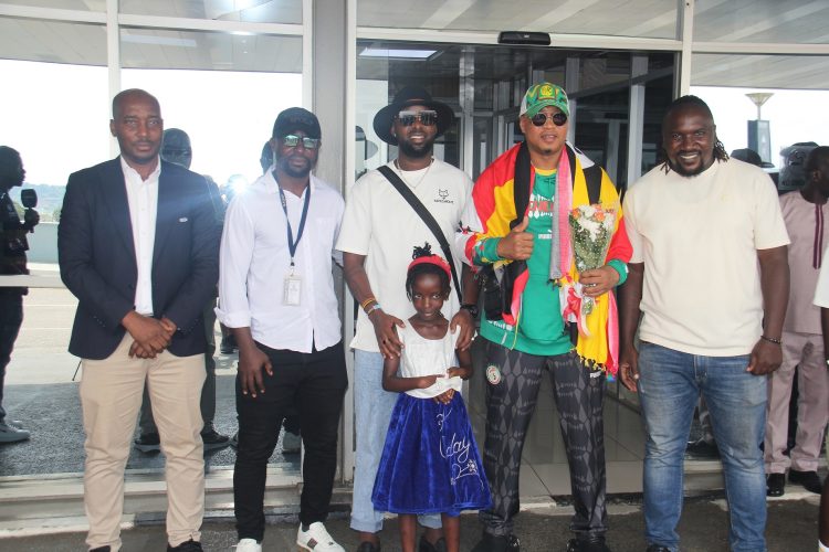 Senior Presidential Adviser on creatives, Mr Edrisah Musuuza (3rd L) aka Eddy Kenzo and Senagalese Legend El Hadji Diouf (2nd R) after his arrival at Entebbe International airport on 08.03.24. Photo / 360newsug