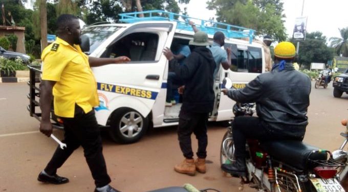 Police battles Entebbe Taxi touts over attacking Fly Express Operators, Passengers