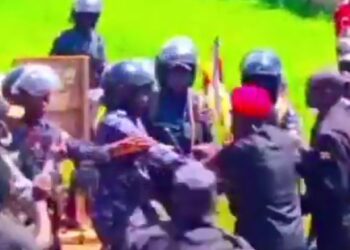 Bobi Wine Fights Off Police Officers To Save Supporter From Brutality