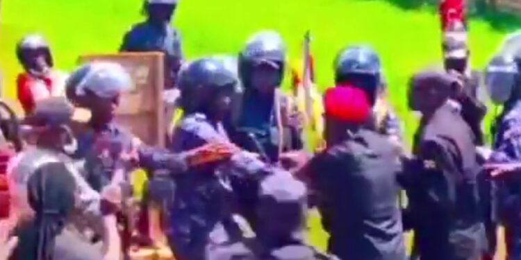 Bobi Wine Fights Off Police Officers To Save Supporter From Brutality