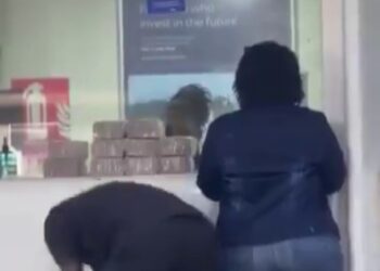 Video of Police Officer Banking Bundles of Millions Shocks Ugandans