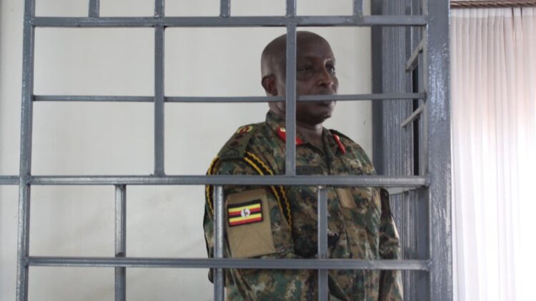 Maj Gen James Birungi follows court proceedings before the General court martial at Makindye recently Photo/UPDF